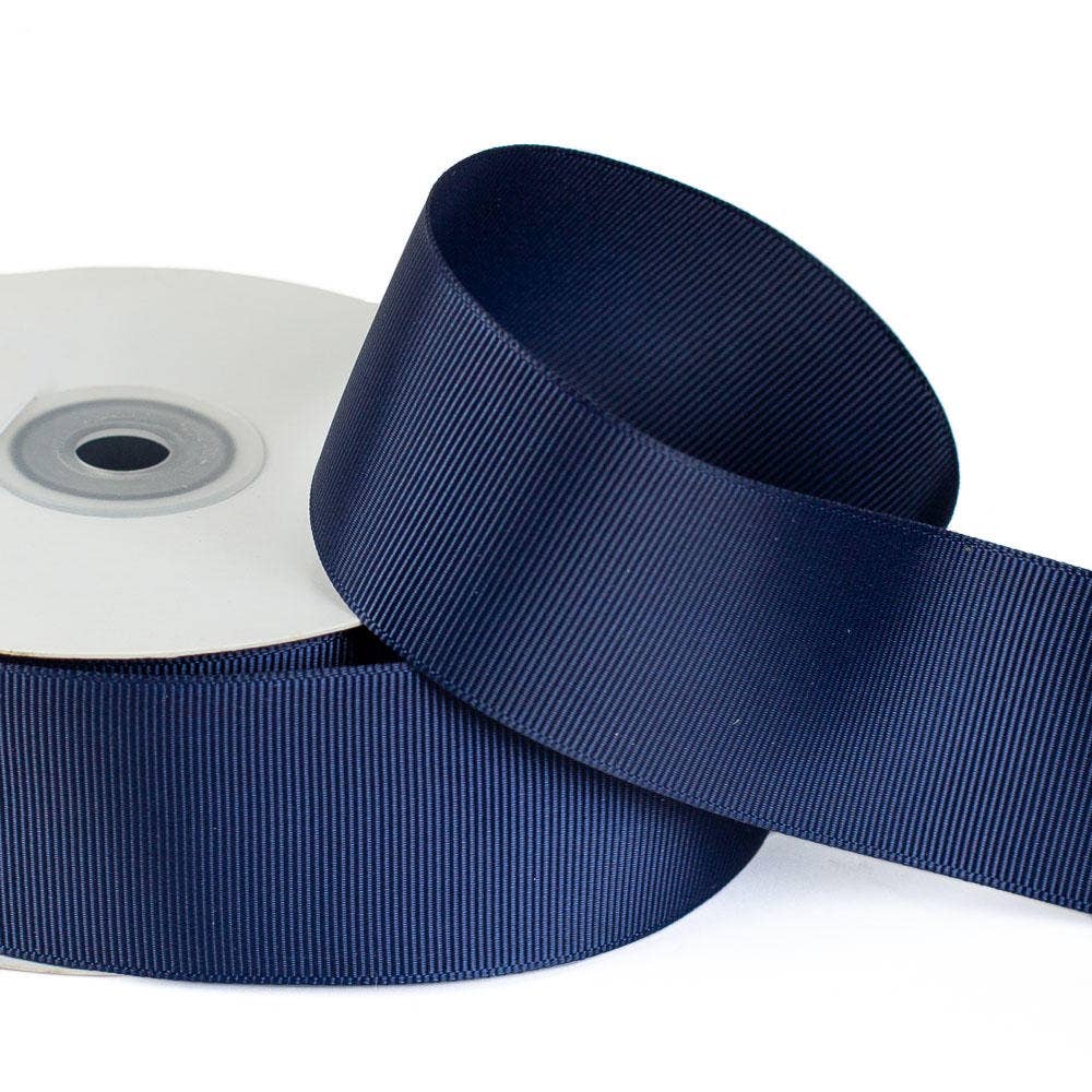 1-1/2″ Navy Blue Grosgrain Ribbon, 25 yard roll, textured polyester.