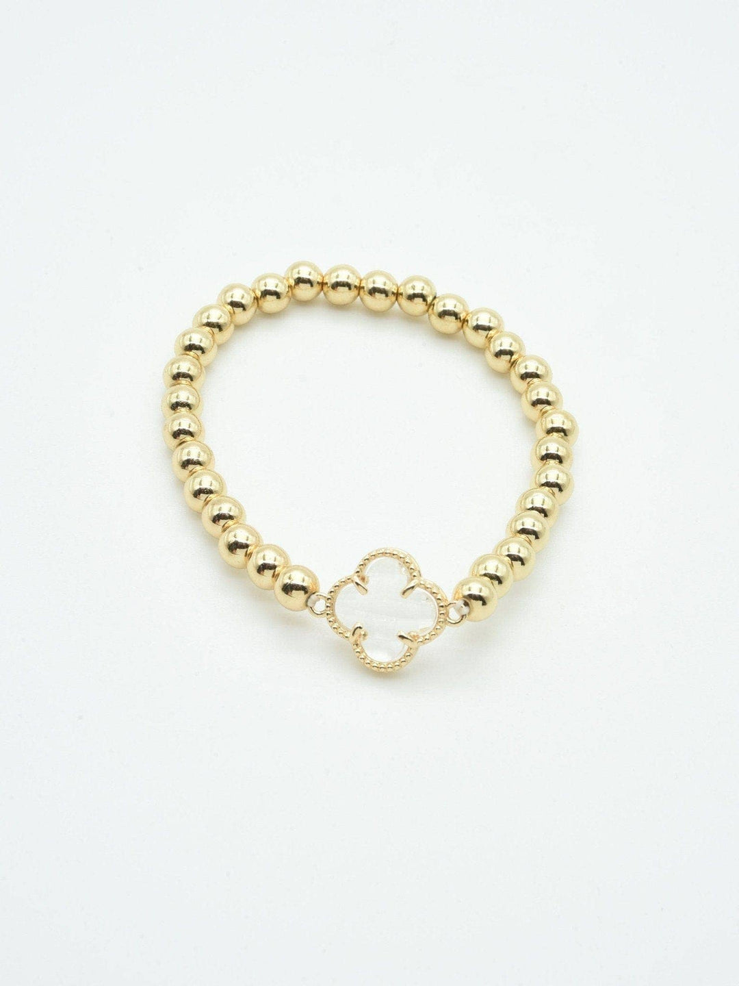 Gold beaded bracelet with central crystal clover charm. Available sizes: S, M, L.