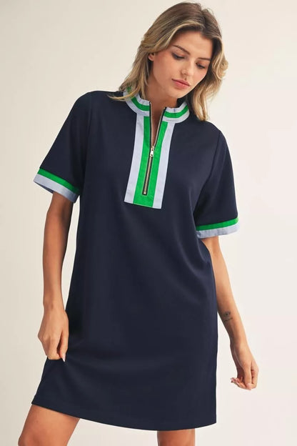 Short Sleeve Navy Zip Up Dress with green and white trim and front zipper detail; available in sizes XS-XL.