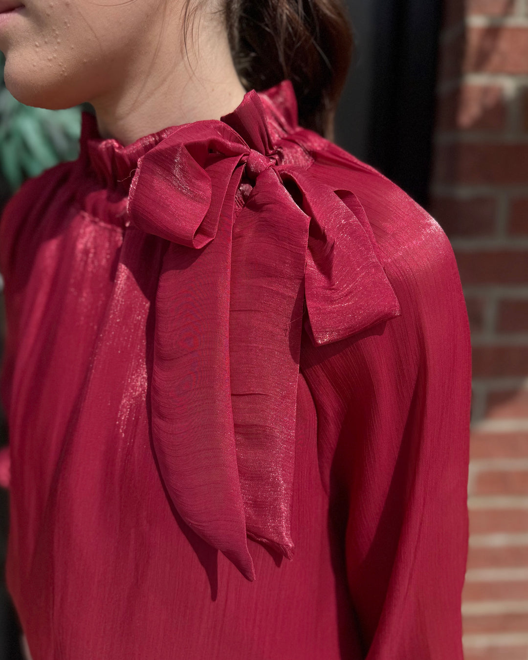Ruffle Neck Adjustable Tie Long Sleeve Blouse in shiny red, available in sizes XS-XL.