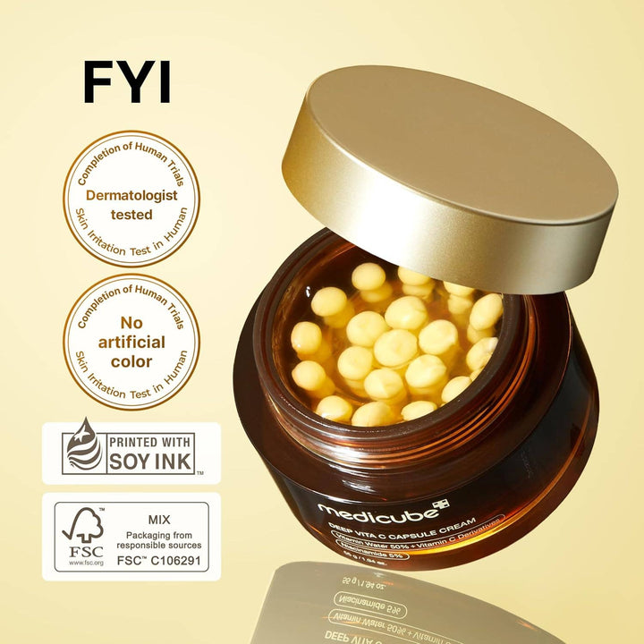 Open jar of MEDICUBE Deep Vita C Capsule Cream with yellow capsules. Available in 50g. Dermatologist tested, no artificial color.
