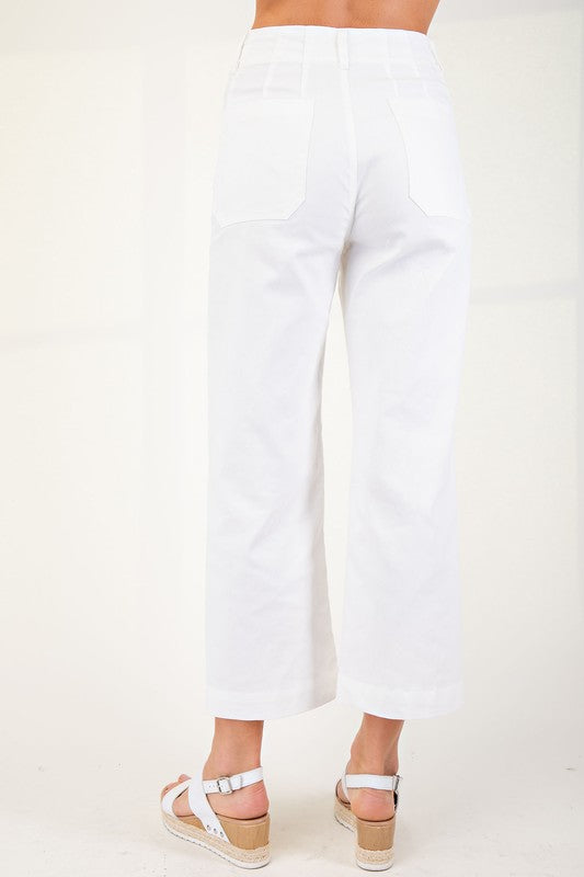 High-waisted, wide-leg, white ankle-cropped summer pants in stretchy denim-like fabric. Sizes: XS-XL.