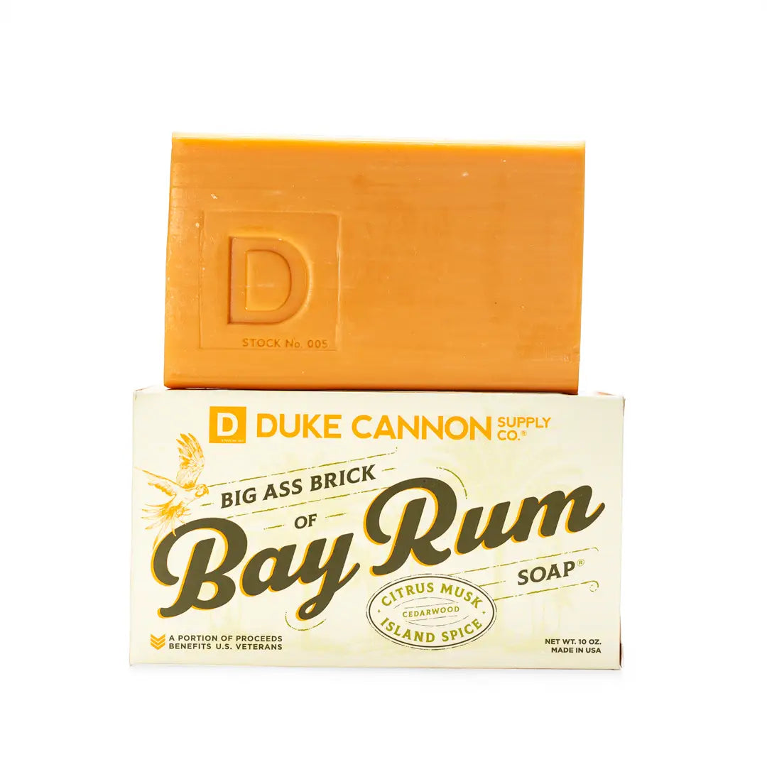 The Big Ass Brick of Soap - Bay Rum: Orange triple-milled bar soap with notes of citrus musk, cedarwood, and island spice. Sizes available: 10 oz. Proceeds benefit U.S. veterans.