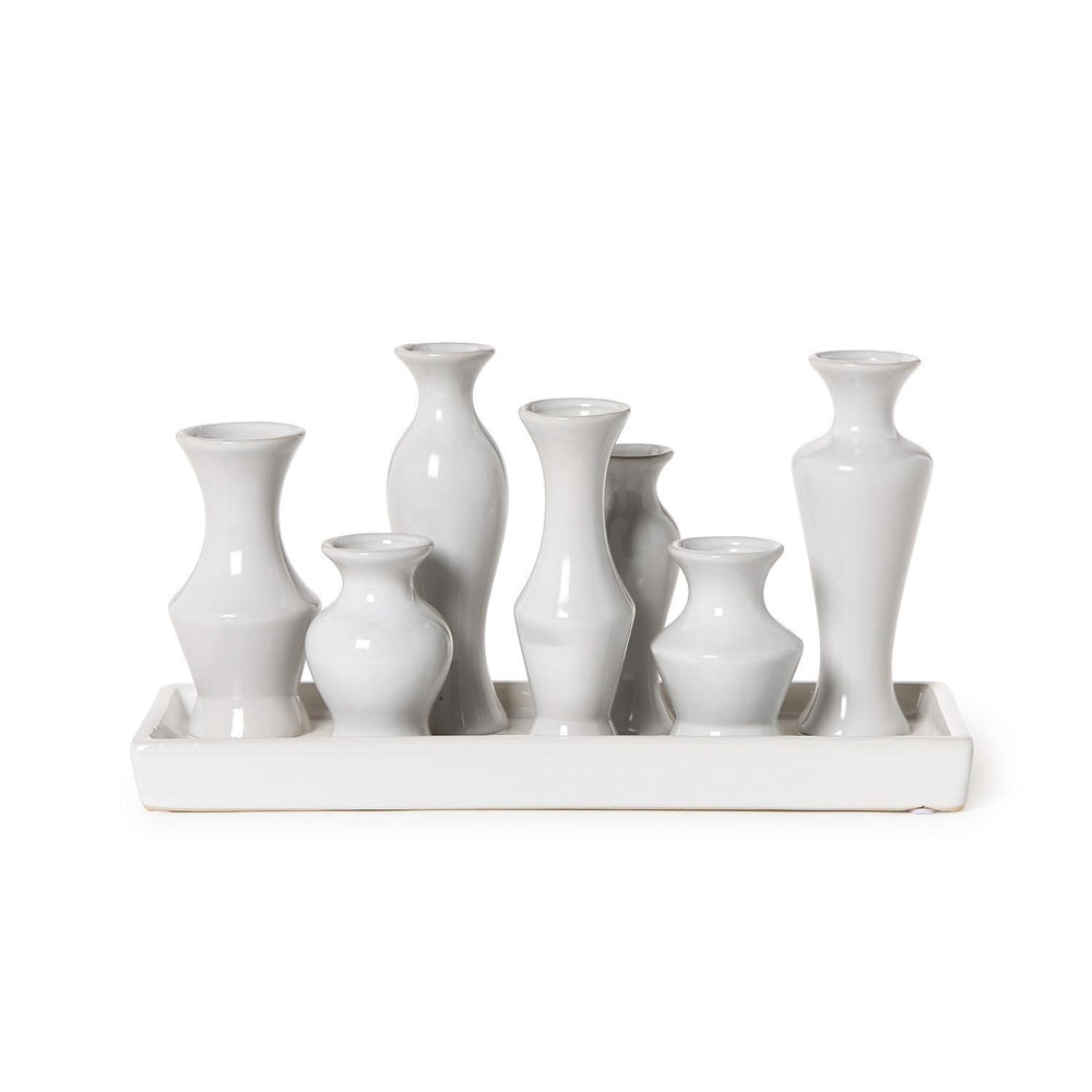 White Glaze Multi Vase with 7 sections; seven small, uniquely shaped white vases on a rectangular base. Sizes: Small, Medium.