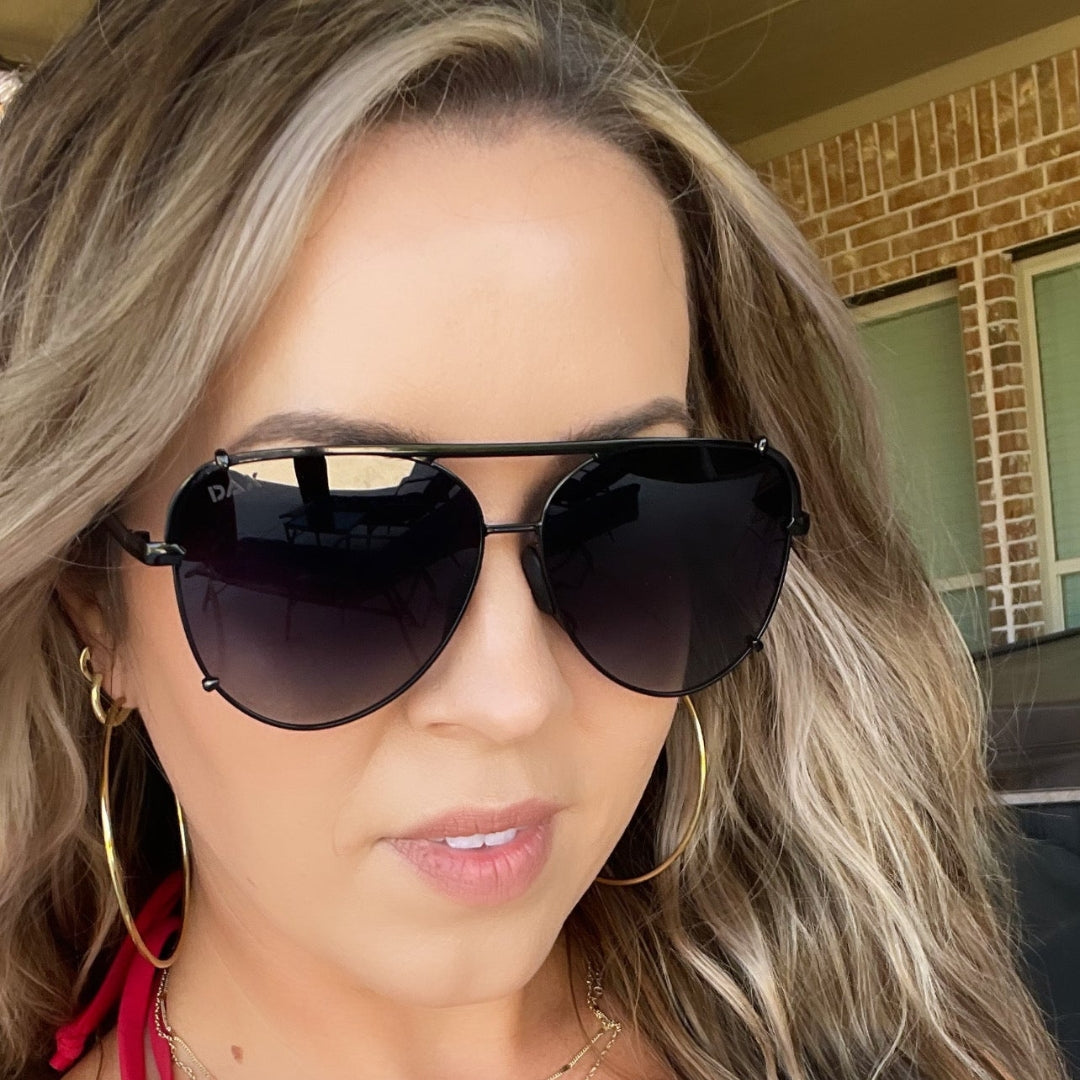 Large black Dax Shay Sunglasses with UV 400 protection, available in sizes S, M, and L.