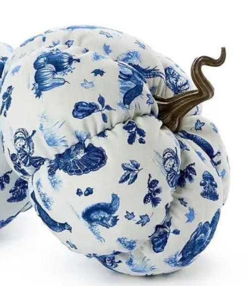 Falling For Blue Toile Fabric Pumpkin made of plush blue and white fabric with leaf, squirrel, and vegetable patterns, topped with a brown curly stem. Available in multiple sizes.
