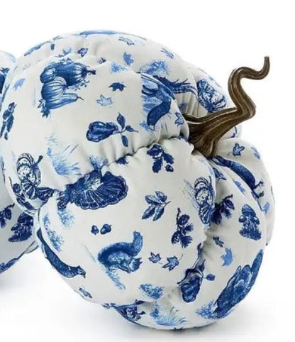 Falling For Blue Toile Fabric Pumpkin made of plush blue and white fabric with leaf, squirrel, and vegetable patterns, topped with a brown curly stem. Available in multiple sizes.