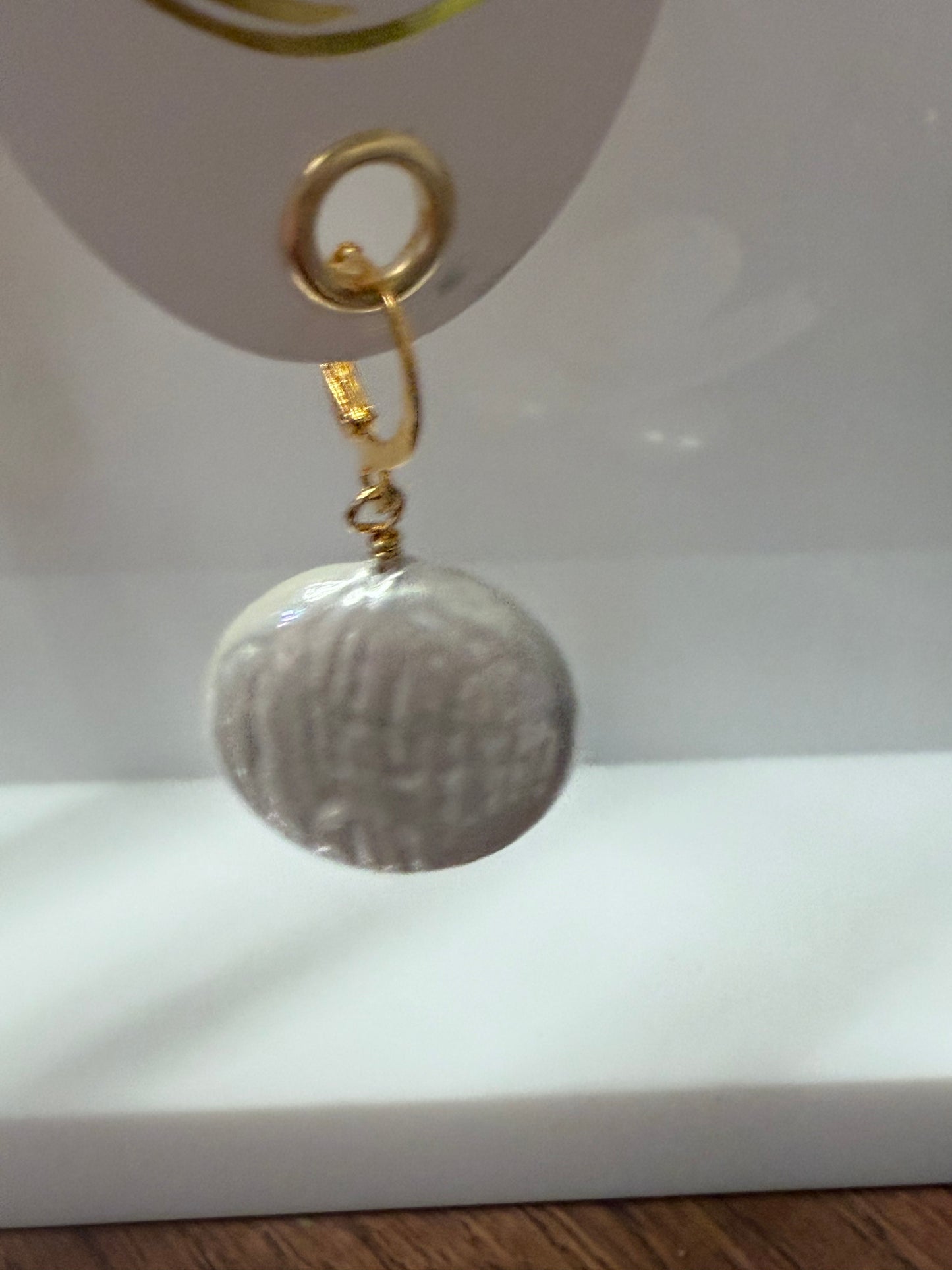 Scarf Necklace Charm with large, round, textured silver-gray pendant; gold accent; subtle wavy lines. Sizes: S, M, L.