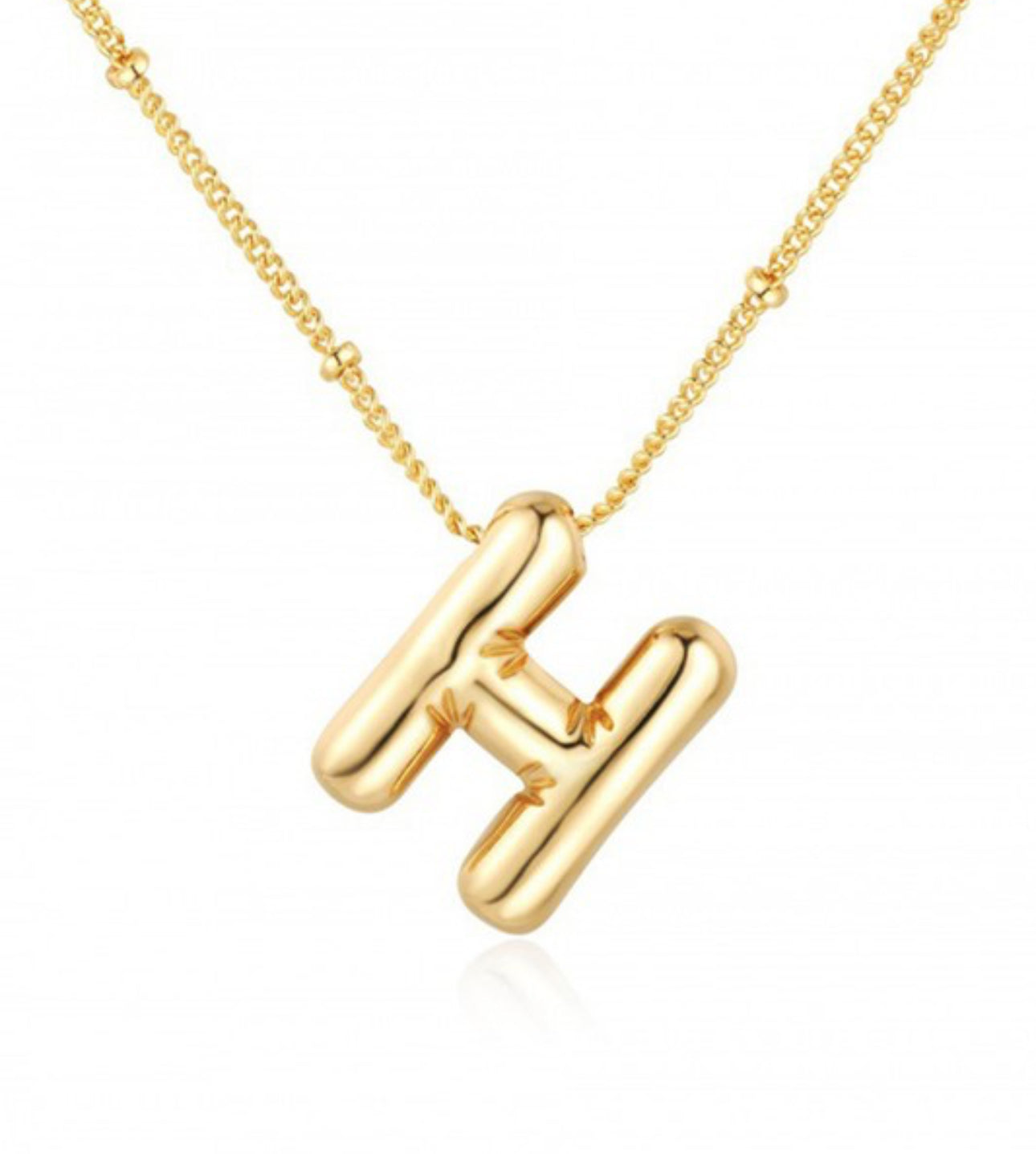 The Bubble Balloon Initial Necklace features a pendant in the shape of the letter "k". It comes with a decorative bead designed chain that reflects light. Personalized options are available. Comes in multiple sizes.