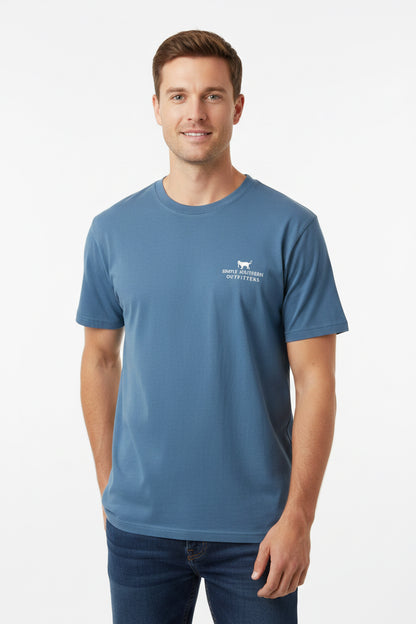Men’s Blue Camo Dog Shirt with “Southern Marsh Collection Outfitters” logo on chest, white tag at collar, available in sizes S-XL.