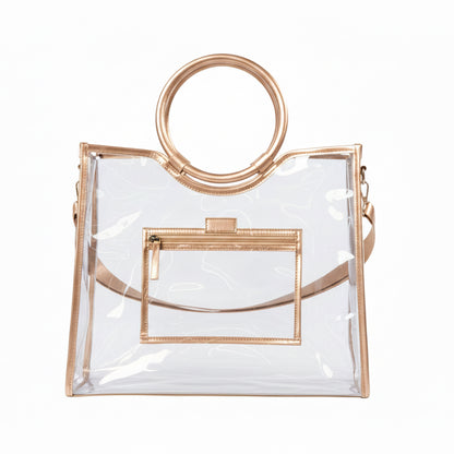 Clear PVC tote with gold trim, round gold handles, detachable matching strap, and front zippered pocket. Available in multiple sizes.