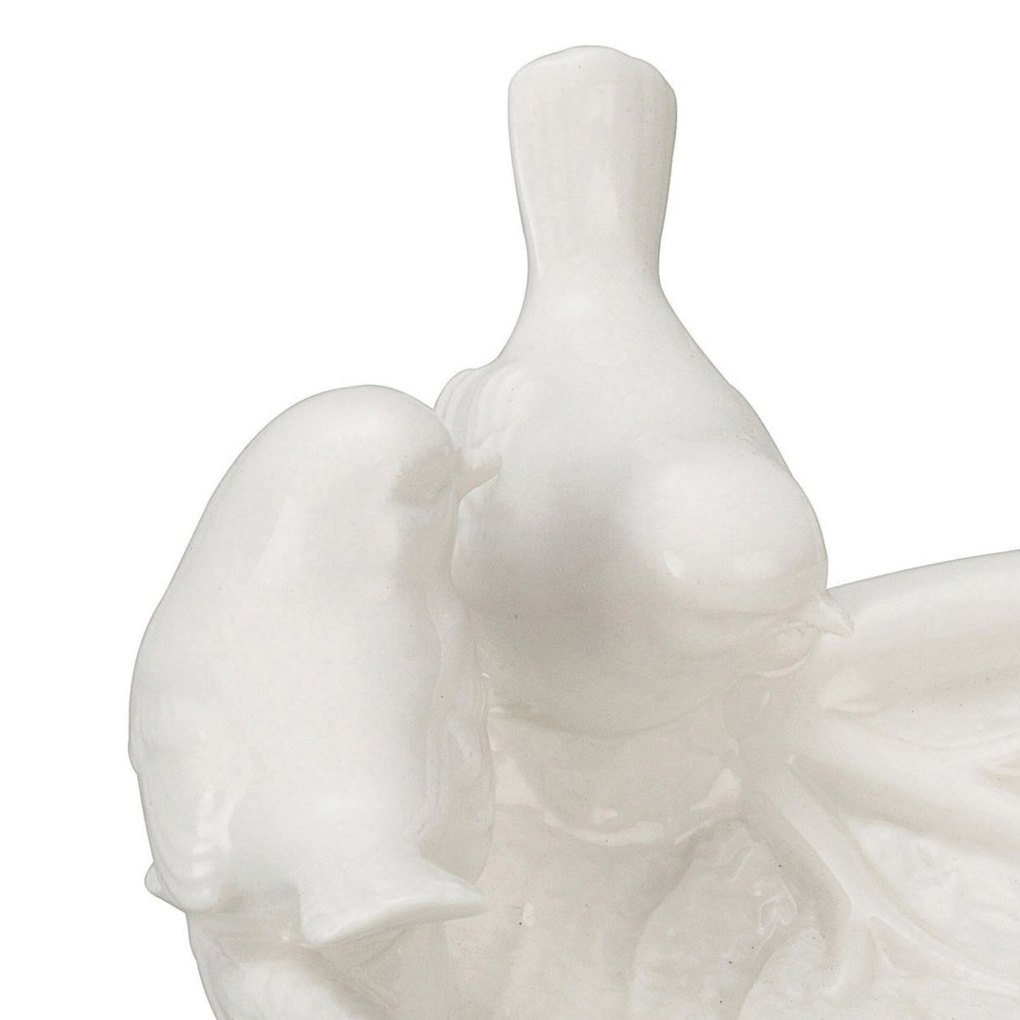 Glossy white ceramic birds on a decorative leaf dish. Fine detailing. Available sizes: Small, Medium, Large.