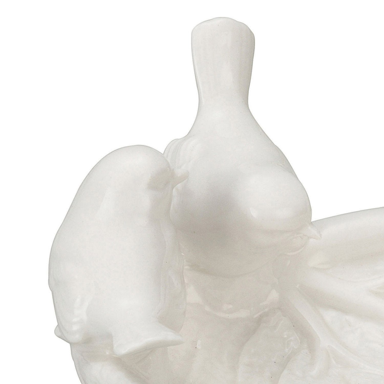 Glossy white ceramic birds on a decorative leaf dish. Fine detailing. Available sizes: Small, Medium, Large.