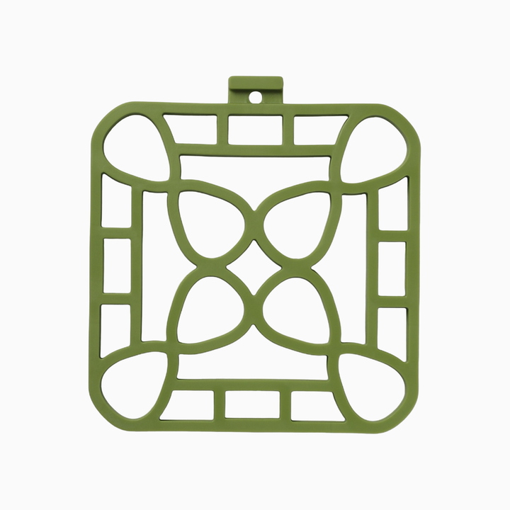 Green square silicone trivet with geometric cut-out, small hanging loop; available in multiple sizes; heat-resistant.