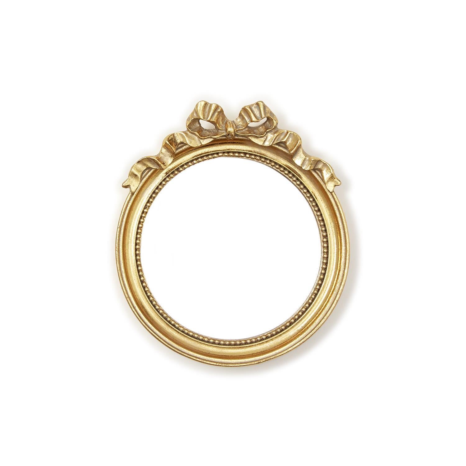 Ornate gold round mirror trinket tray with accent bow. Available sizes: small, medium, large.