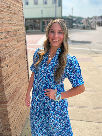 Bright Blue Printed Button Down Midi Dress with ruffled collar; available in sizes XS-XL.