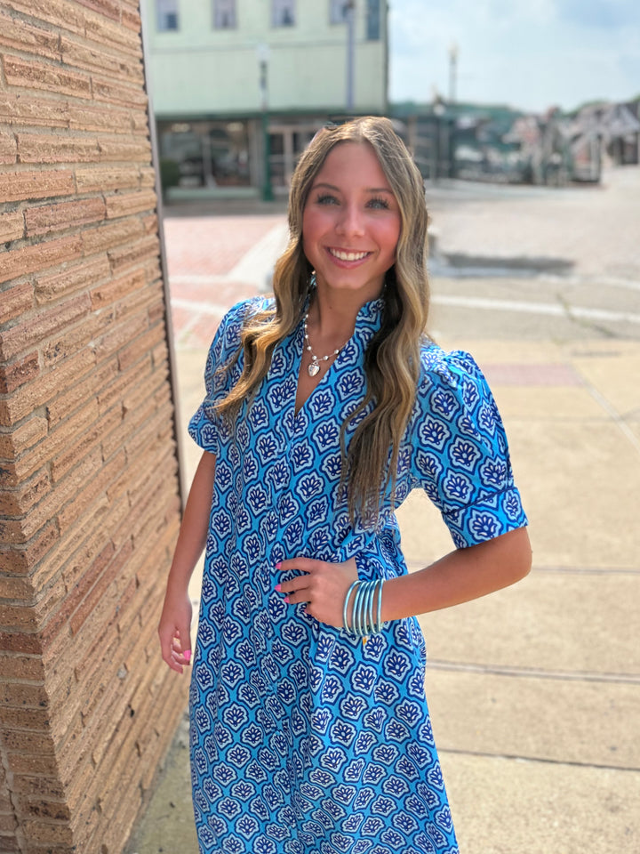 Bright Blue Printed Button Down Midi Dress with ruffled collar; available in sizes XS-XL.
