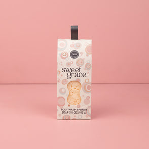 Sweet Grace Body Wash Sponge in a rectangular box with circular patterns and black handle. Available in standard size.
