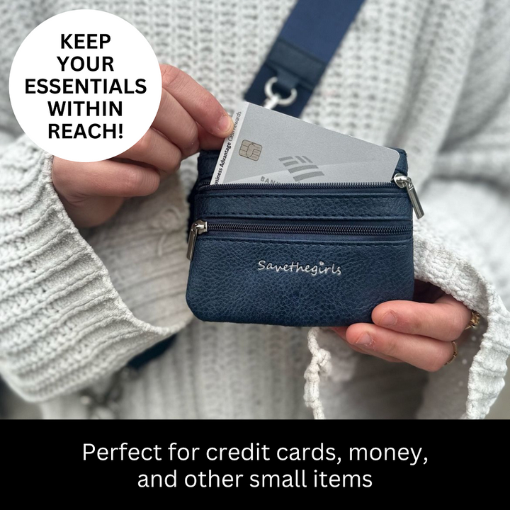Small navy Save the Girls Clip and Go Zippered Pouch shown with a credit card inside. Available sizes: small, medium, large.