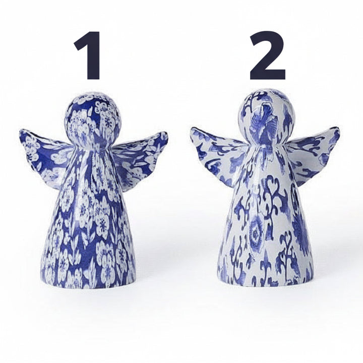 Two blue and white floral angel figurines.