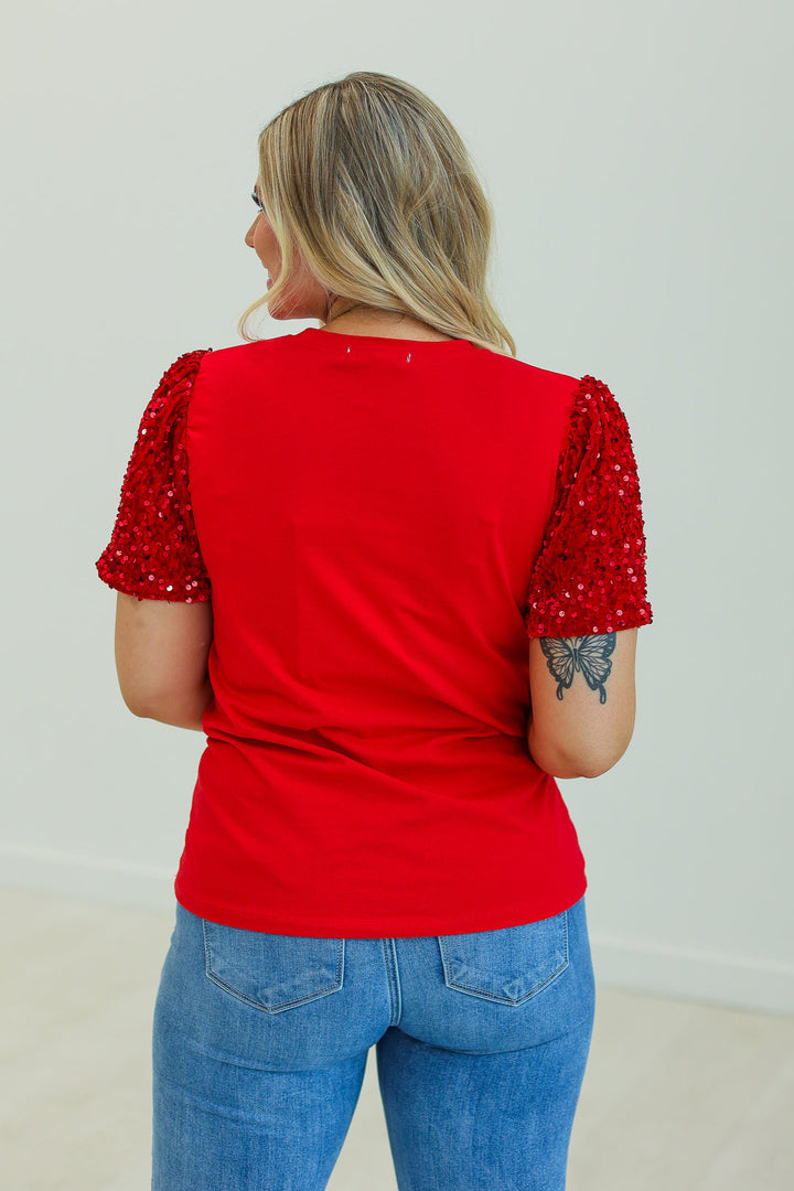 Relaxed-fit red top with sequined short sleeves. Available in all sizes.