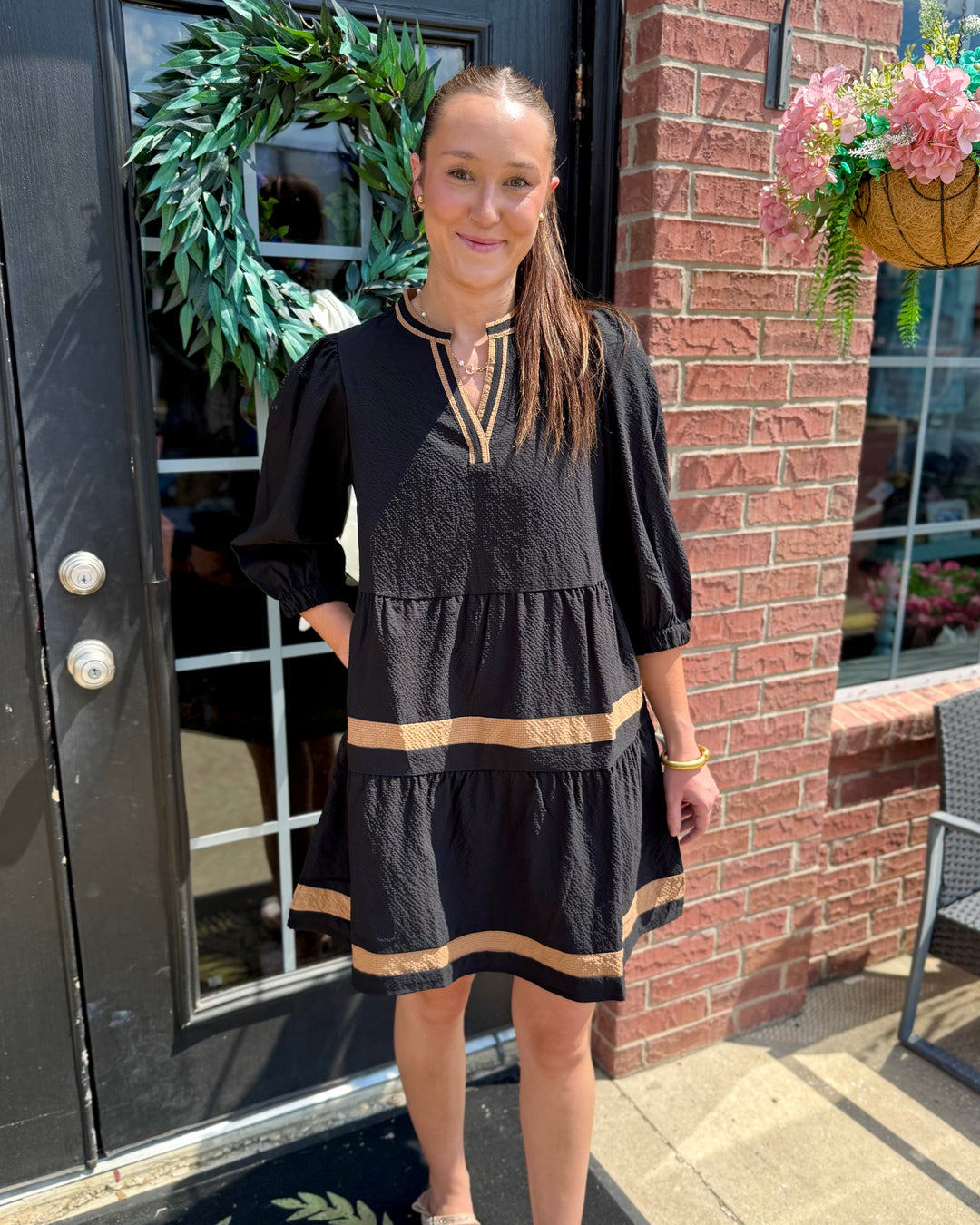 Cooper Dress | Black + Tan: black fabric with gold stripes, V-neckline, tiered skirt. Available in sizes XS–XL.