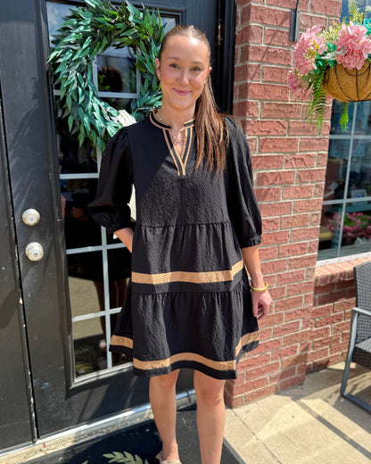Cooper Dress | Black + Tan: black fabric with gold stripes, V-neckline, tiered skirt. Available in sizes XS–XL.