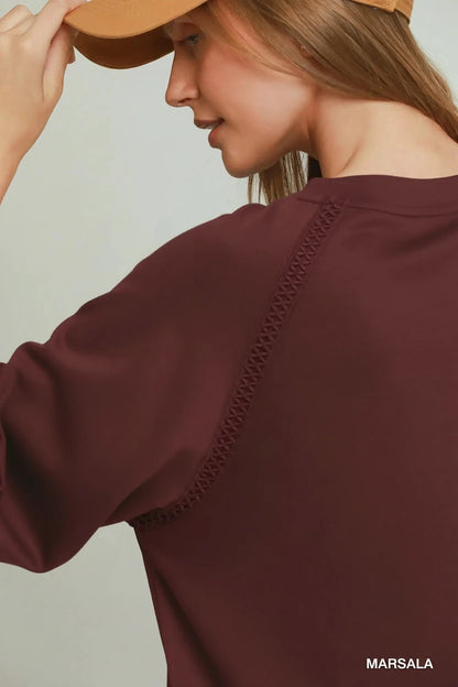 Marsala Butterfly Lace Raglan Sleeve Top with decorative stitching along the raglan sleeve seam. Available in sizes S–XL.