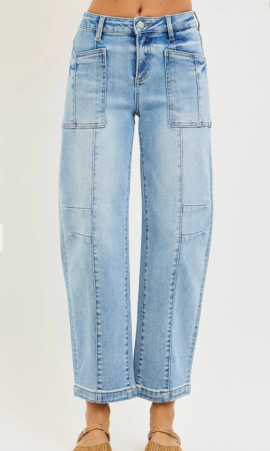 Risen high-waisted, light-wash barrel-leg boyfriend jeans with front patch pockets and a relaxed straight-leg fit.