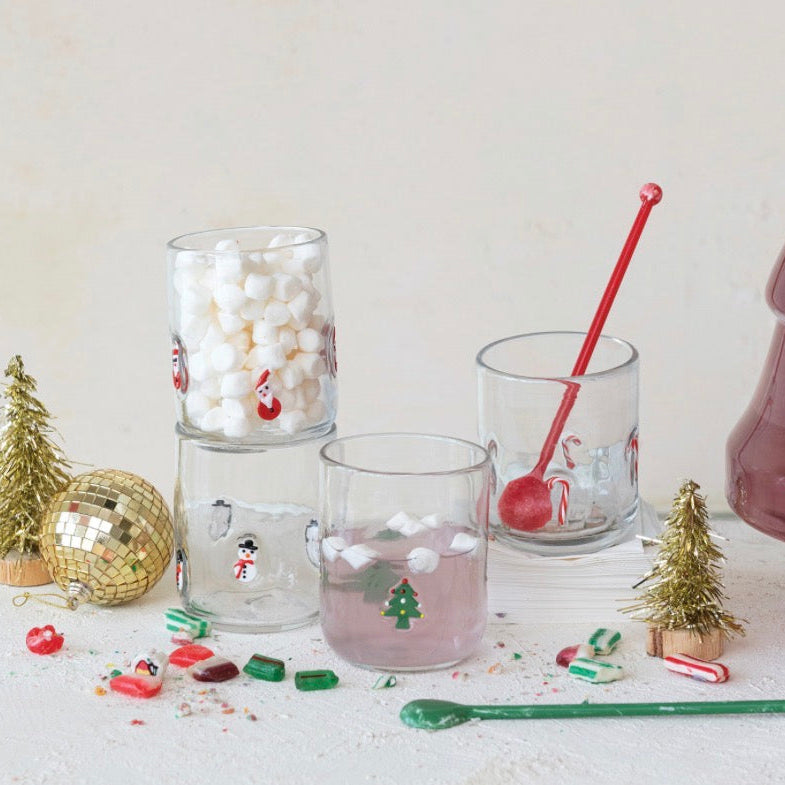 Three Holiday Icon Glass tumblers featuring snowman, Christmas tree, and Santa Claus designs.