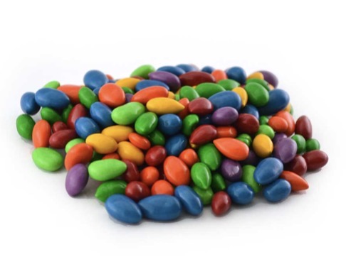 Chocolate sunflower seeds coated in rainbow colors (blue, green, yellow, orange, red, purple); available in assorted sizes.