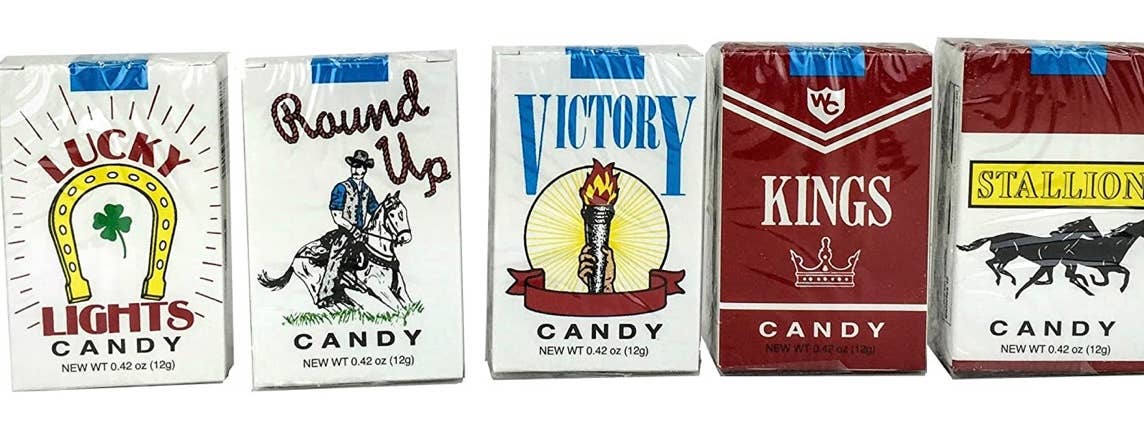 Five nostalgic candy cigarette boxes—Lucky Lights, Round Up, Victory, Kings, Stallion. Available in standard mini pack size.