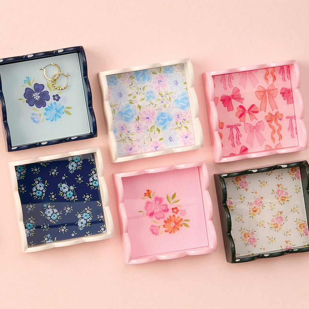 Six square Scallop Trinket Trays with scalloped edges and floral bow patterns in pastel, navy on light pink. Sizes: various.