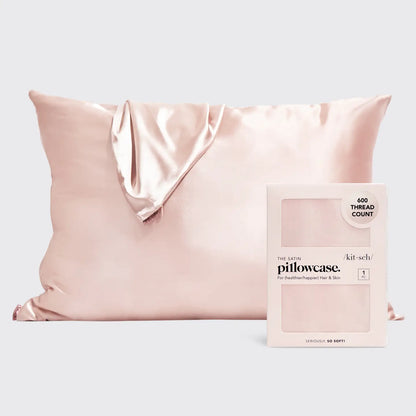 The Satin Pillowcase - Blush features shiny light pink satin and a luxurious 600 thread count. Designed for frizz-free sleep. Available in standard and king sizes.