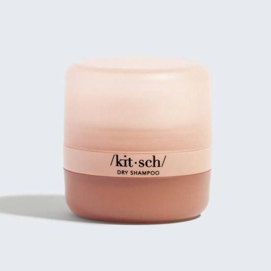 Small, rounded Volumizing Rice Protein Dry Shampoo, gradient pink-beige design, bold black text. Available in multiple sizes.