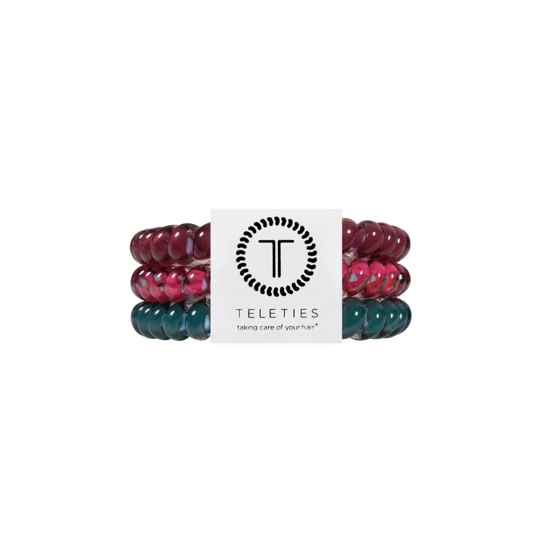 Set of three Harvest Hues Small Hair Ties in maroon, pink, and teal with a white TELETIES brand card displaying the logo and “taking care of your hair” slogan. Available in small size.