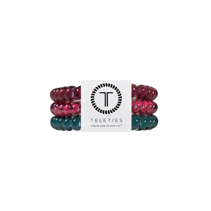 Set of three Harvest Hues Small Hair Ties in maroon, pink, and teal with a white TELETIES brand card displaying the logo and “taking care of your hair” slogan. Available in small size.