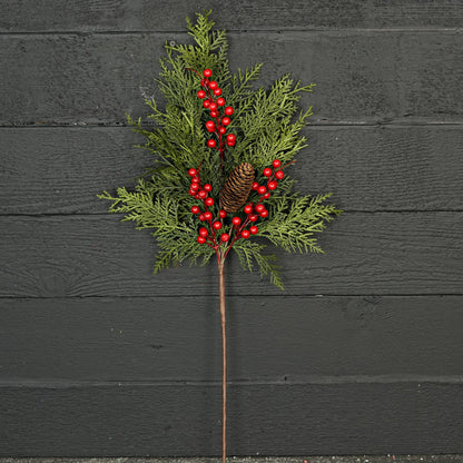 The Superior Real Touch Mix Cedar is a festive 29-inch branch with lifelike cedar sprigs, green pine branches, a small pine cone, and vibrant red berries on a single stem. Available in 29-inch size.