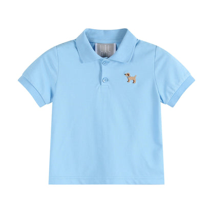 Light blue boys' polo shirt with collar, two buttons, and small dog embroidery. Available in sizes XS-XL.