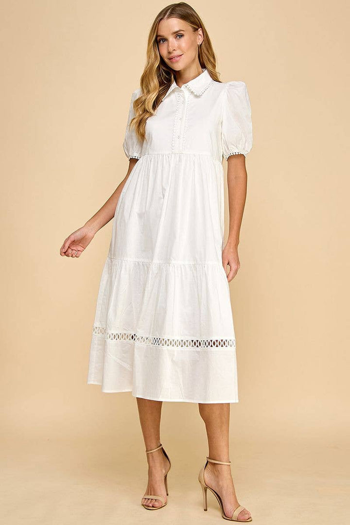 White button-up collared midi dress with contrast trim and short sleeves. Available in sizes XS-XL.