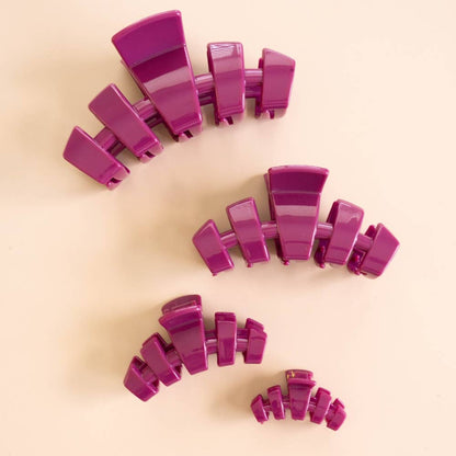 Four purple Classic Mulberry Large Claw Clips shown in four different sizes, including the large size.