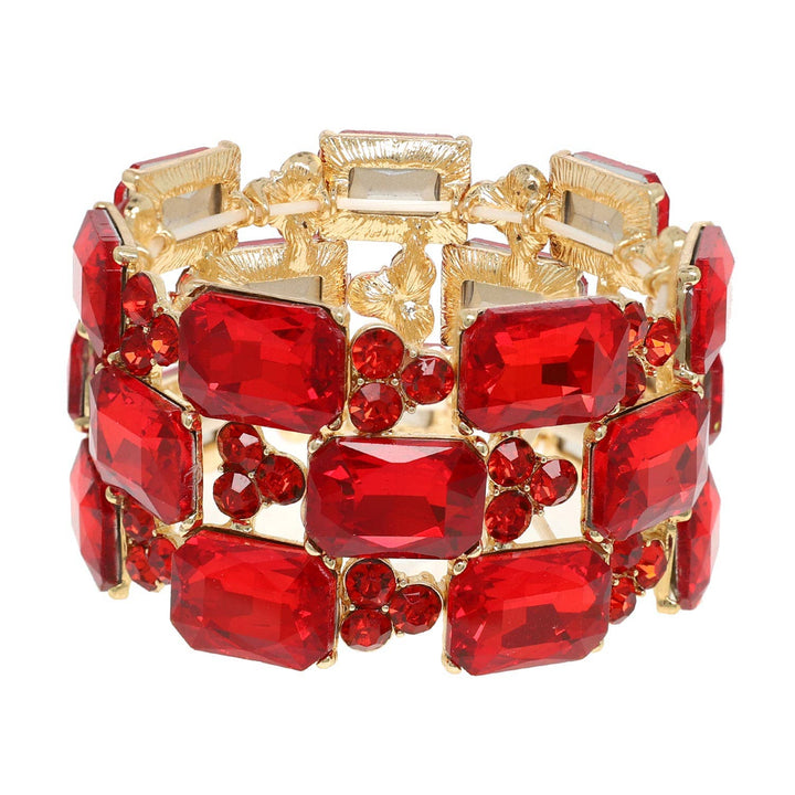 Gold bracelet with wide bands, large rectangle and small round red crystals. Available in S, M, L.