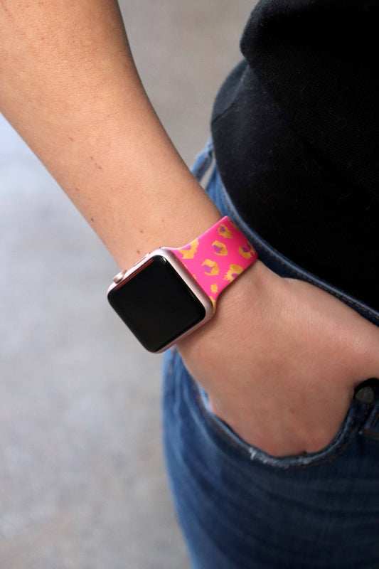 Pink Cheetah Apple Watch Band, silicone, pink with yellow spots. Available in 38/40mm. Watch screen off.