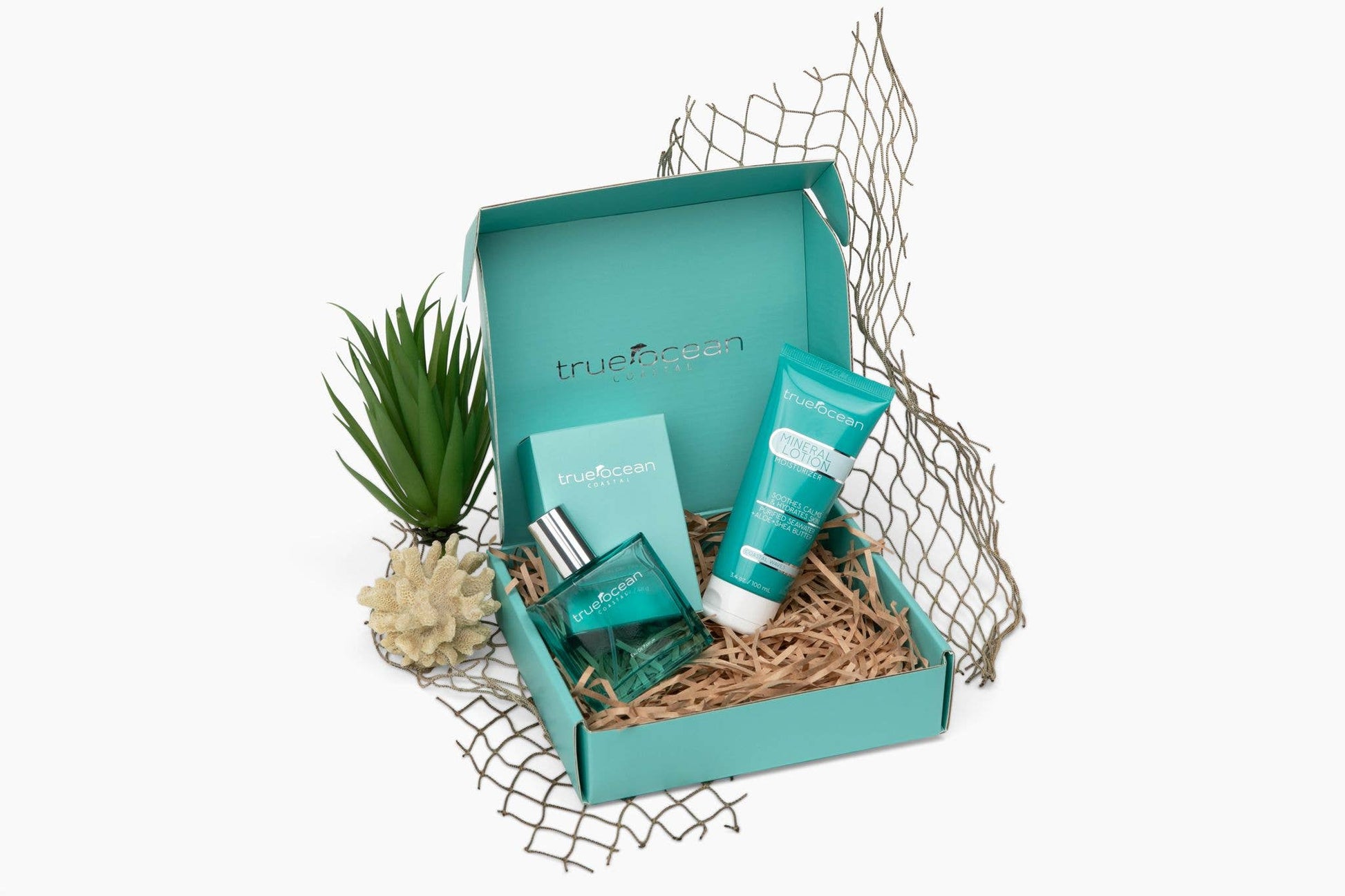 True Ocean Mineral Lotion, 3.4oz, enriched with ocean minerals, shown with two bottles and a tube in a turquoise box.