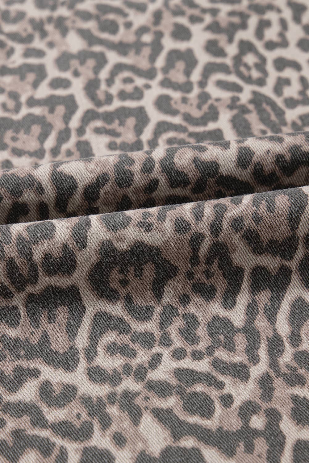 Leopard print fabric in black and dark brown on beige, for Missy Leopard HW Frayed Edge Wide Jeans. Sizes: XS-XL.