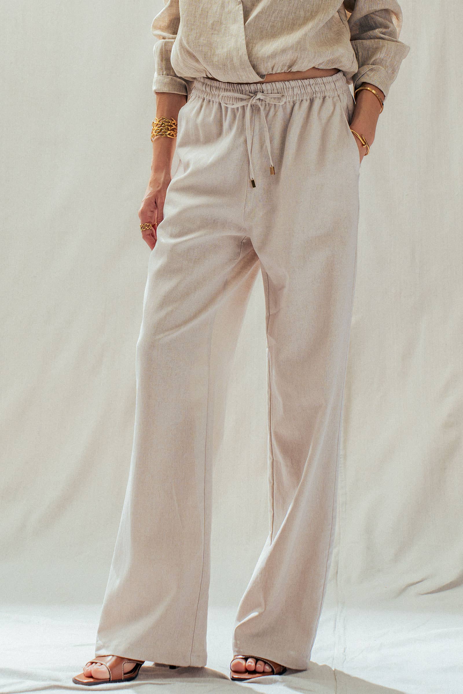 Mint Jelly Linen Blend Wide Leg Drawstring Pants in light beige, available in sizes XS-XL.