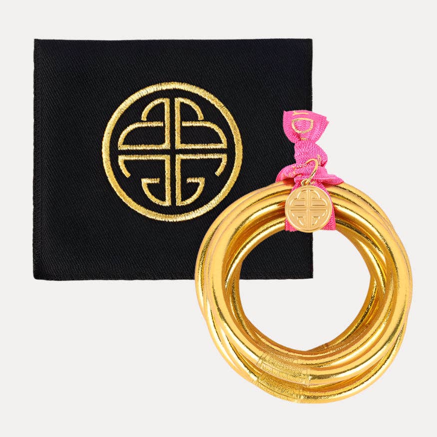 Gold All Weather Bangles® Set of 9 with Serenity Prayer, tied with pink ribbon and gold charm; available in S, M, L.