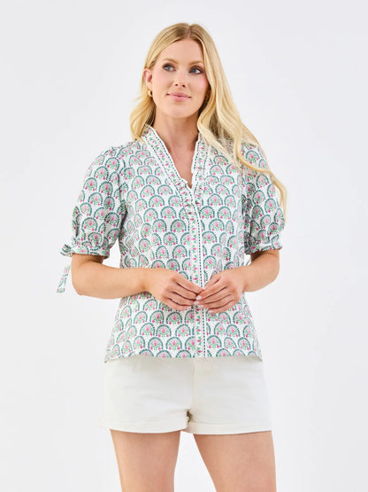 Brynn Sunshower Flora White Top with ruffle mock neckline and puff sleeves. Available in sizes XS-XL.
