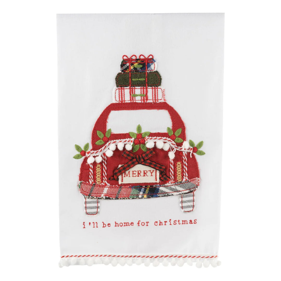 I’ll Be Home for Christmas Tea Towel featuring an embroidered red car carrying wrapped gifts, with “MERRY” on the bumper and “i’ll be home for christmas” stitched below.