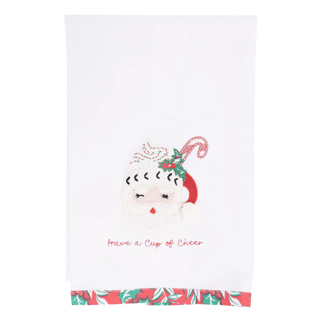 Cup of Cheer Santa Tea Towel featuring an embroidered Santa face in a mug, the text “Have a Cup of Cheer,” and a holly and berry border.